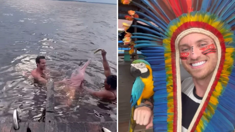 Lucas Bissoli, ex-participante de reality, nada com botos em visita a Manaus