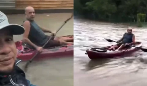 VÍDEO: dupla usa caiaque em rua alagada após forte chuva