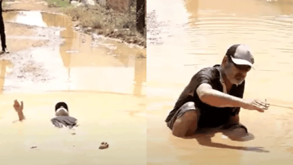 Morador se joga em vala de lama para protestar contra abandono de rua em Porto Velho