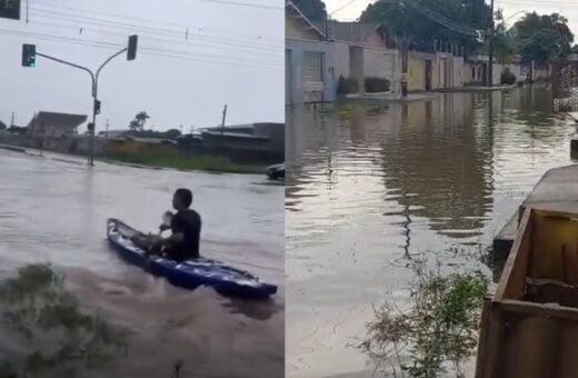 Morador 'passeia' de canoa em rua alagada de Boa Vista